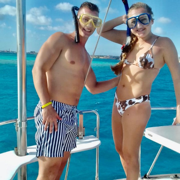 a couple of people that are standing in a pool of water