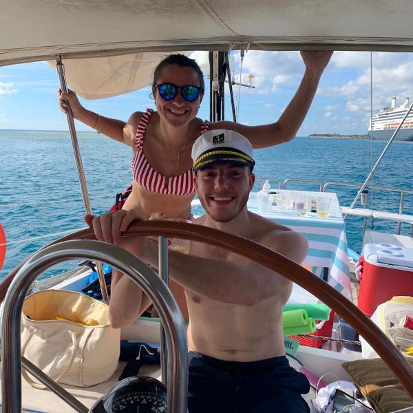 a person standing next to a body of water