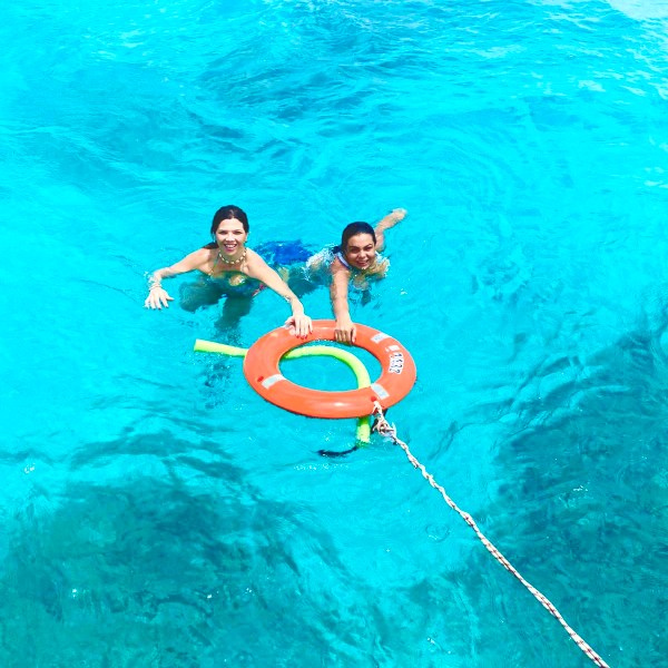 a man swimming in a body of water