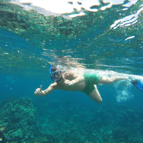 a person swimming in a body of water