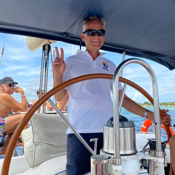 a man standing next to a boat
