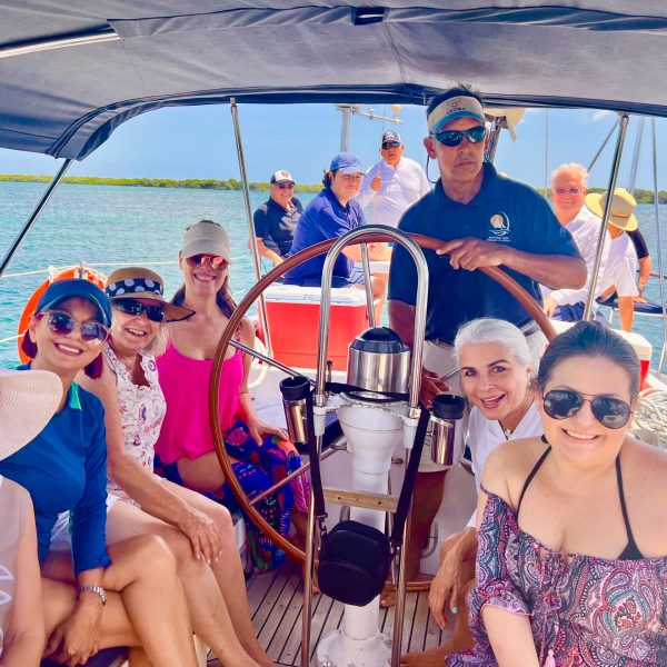 Byron Katie et al. on a boat posing for the camera
