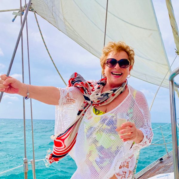 a person standing next to a body of water