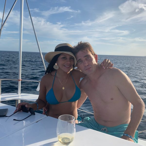 a person sitting on a boat in a body of water