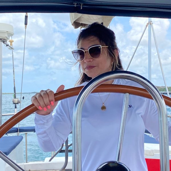 a person riding on the back of a boat