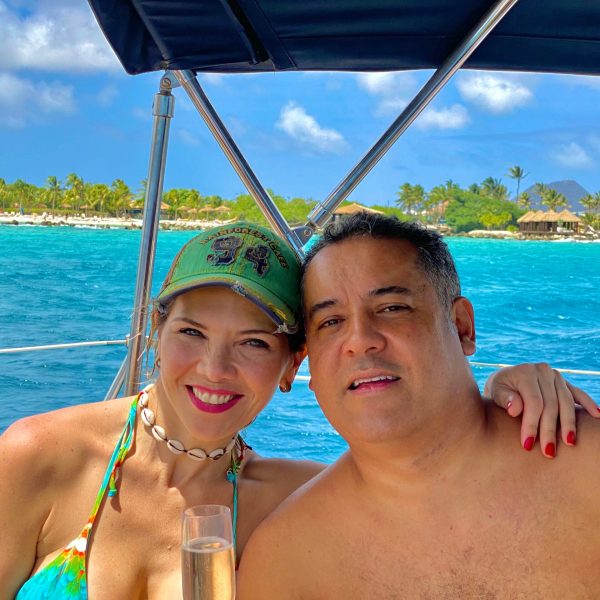 a person standing next to a body of water