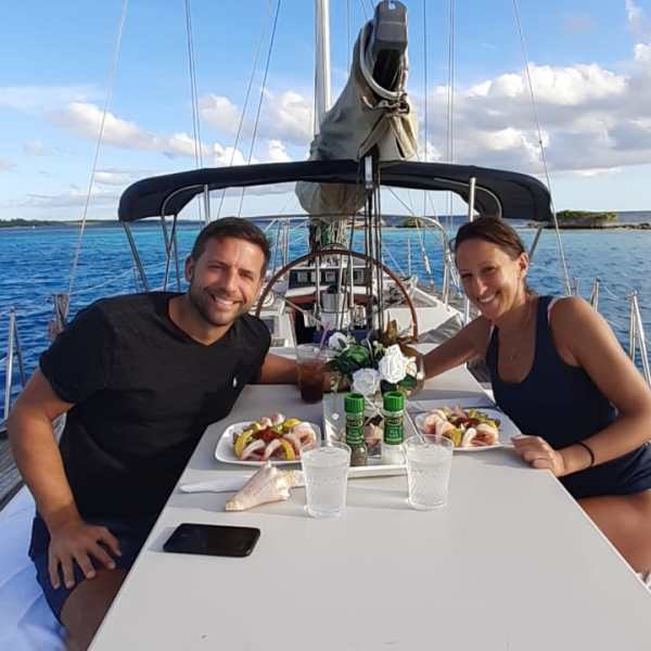 a group of people on a boat in the water