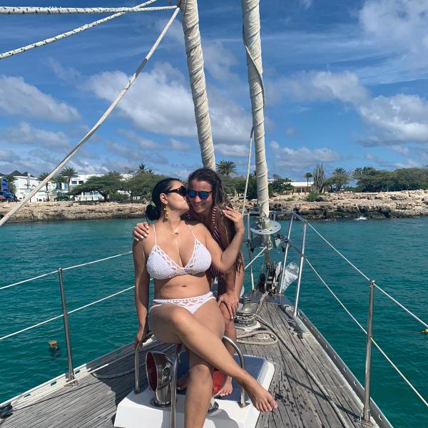 a person standing next to a body of water